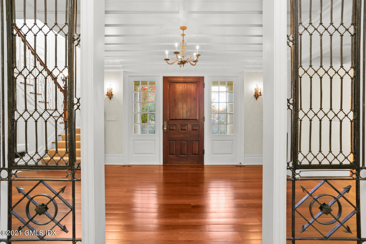 222 Riverside Avenue Riverside, CT 06878 - Photo 6 of 61 a view of a hallway with wooden floor and a dining table