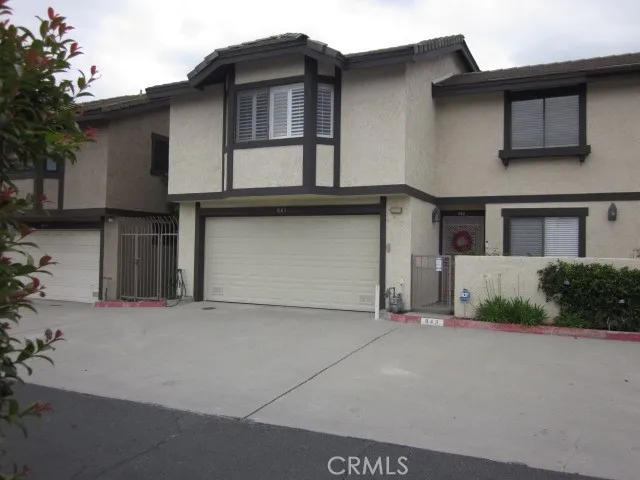 a front view of a house with a garage