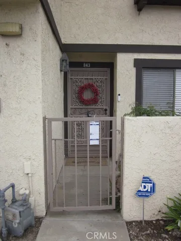 an empty room with wooden floor and a fireplace