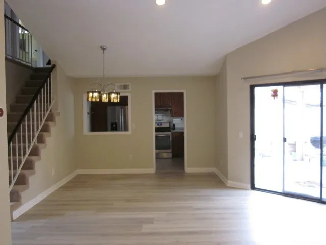 a kitchen with metallic refrigerator freezer and a dishwasher