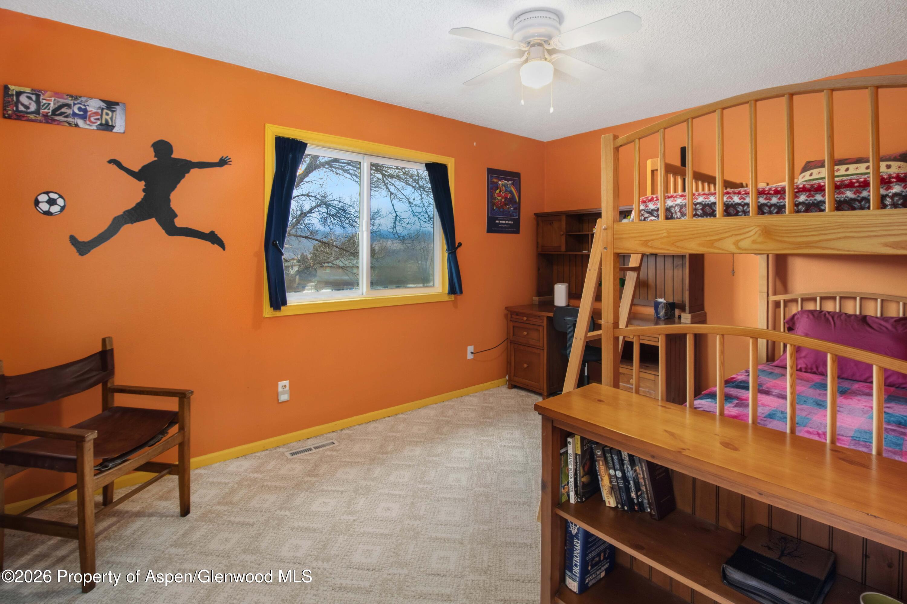 1441 Jays Avenue Rifle, CO 81650 - Photo 15 of 28 a view of a livingroom with furniture window and a ceiling fan