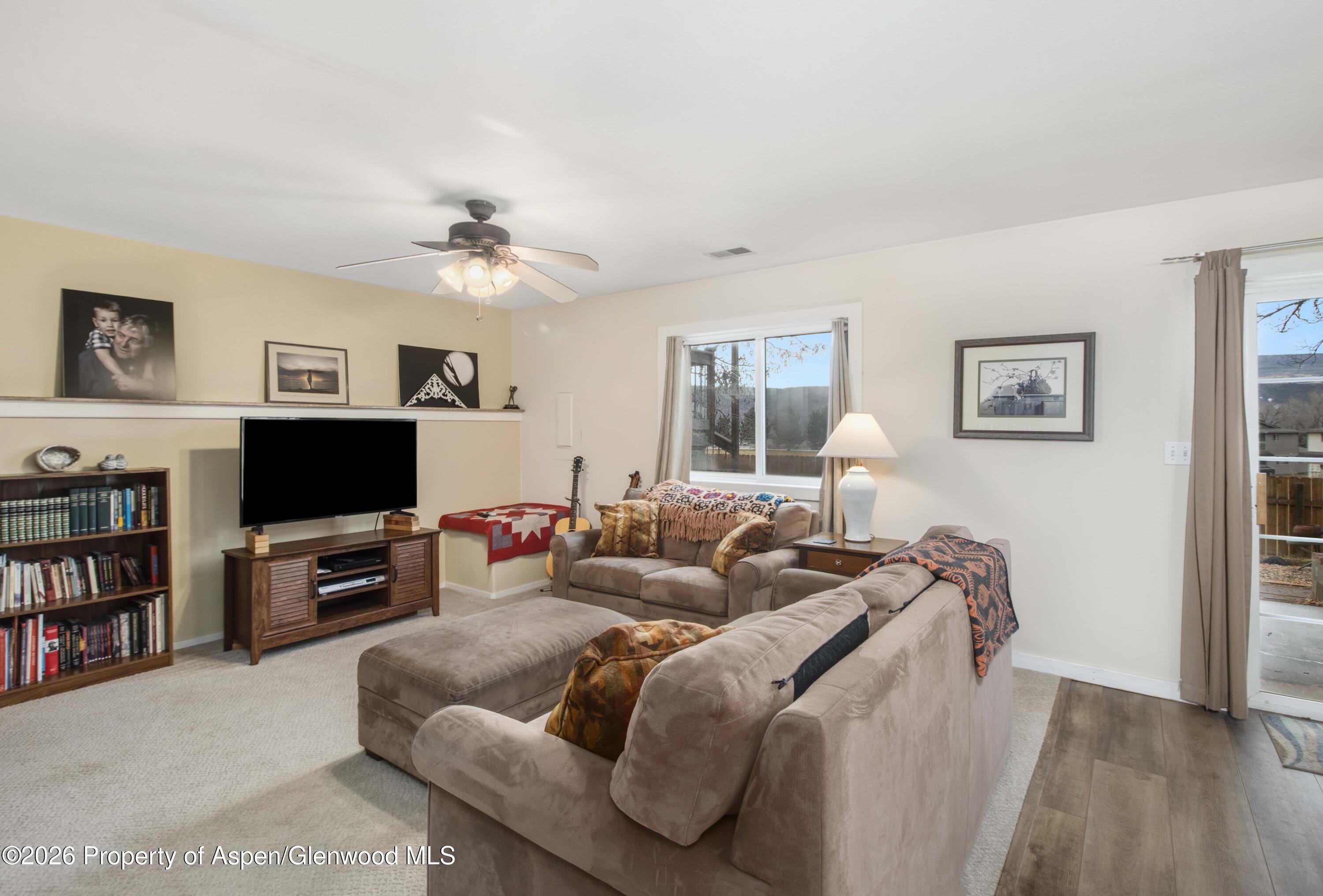 1441 Jays Avenue Rifle, CO 81650 - Photo 17 of 28 a living room with furniture and a flat screen tv