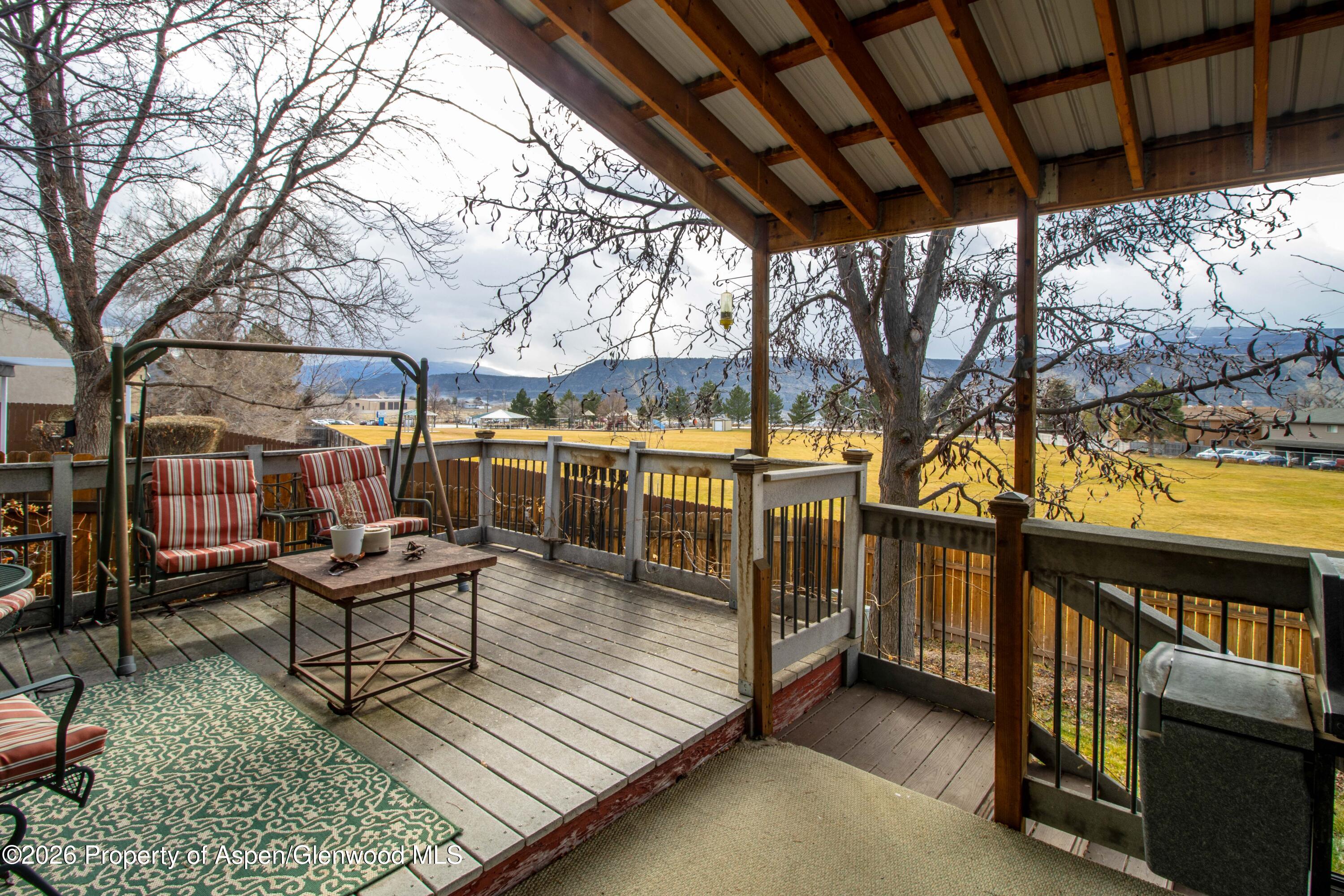 1441 Jays Avenue Rifle, CO 81650 - Photo 19 of 28 a view of a swimming pool with lounge chairs in patio
