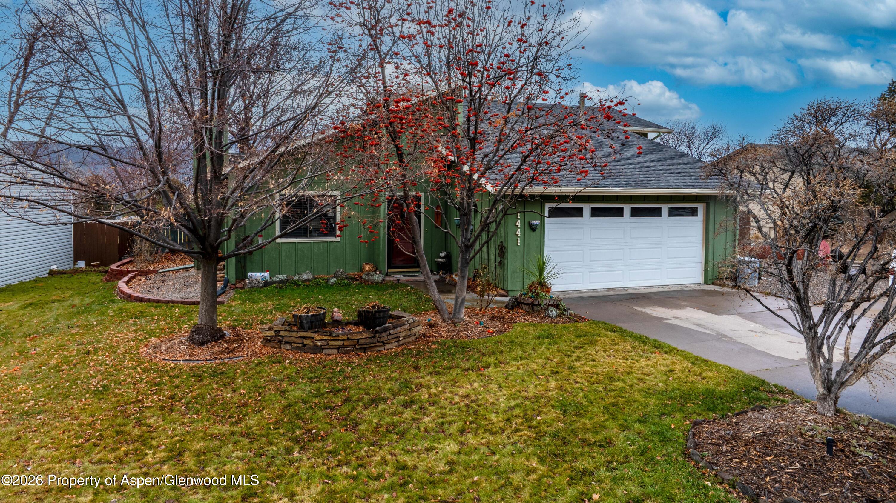 1441 Jays Avenue Rifle, CO 81650 - Photo 27 of 28 a front view of a house with a yard