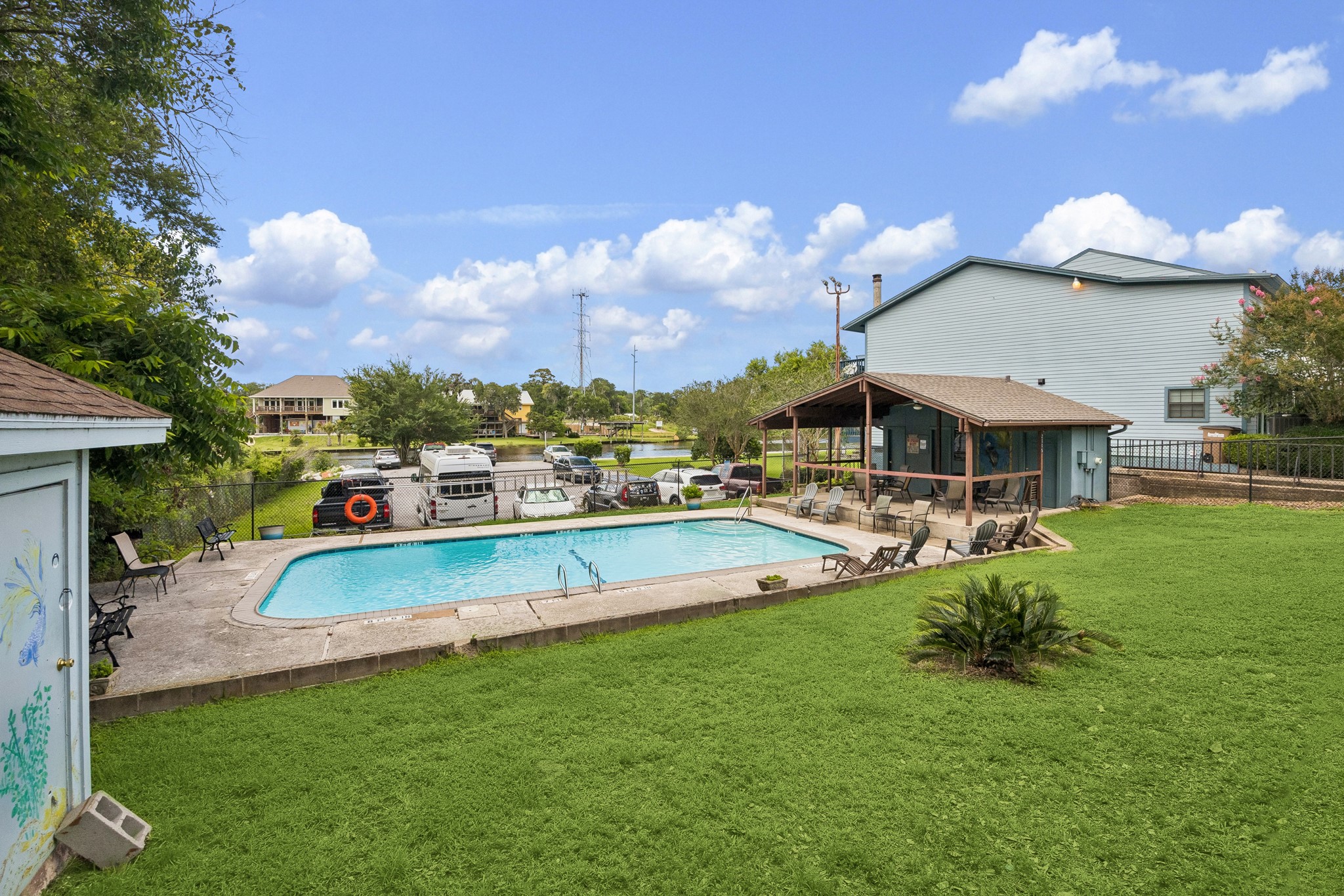 2102 Casa Rio Circle Dickinson, TX 77539 - Photo 20 of 22 The community also features a private pool, changing area & pool house with covered patio! Adjacent to the pool is an oversized, community only, guest parking area! This offers added convenience for your guest and just steps away from Dickinson Bayou, the waterfront boardwalk, and community boat ramp. This waterfront community is a rare combination of recreation, convenience, and waterfront living. ***Bonus ~ No additional fees or parking permits required for your guest***