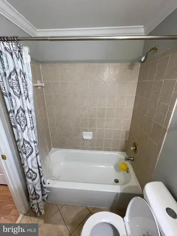 a bathroom with a bathtub and shower