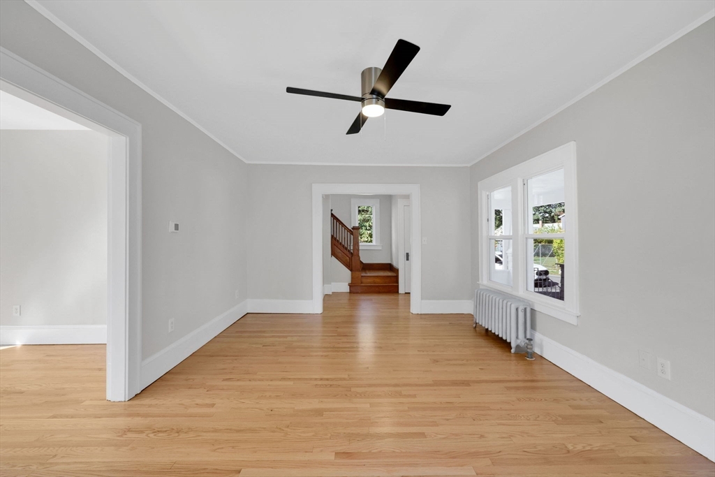 92 Grove Street West Springfield, MA 01089 - Photo 13 of 41 a view of empty room with wooden floor and window