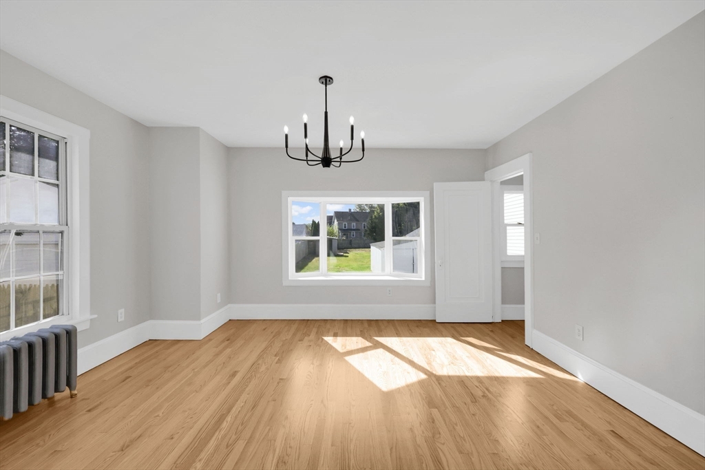 92 Grove Street West Springfield, MA 01089 - Photo 14 of 41 a view of empty room with wooden floor and fan
