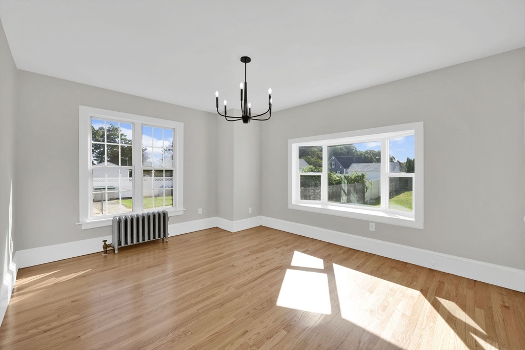 92 Grove Street West Springfield, MA 01089 - Photo 15 of 41 wooden floor in an empty room with a window