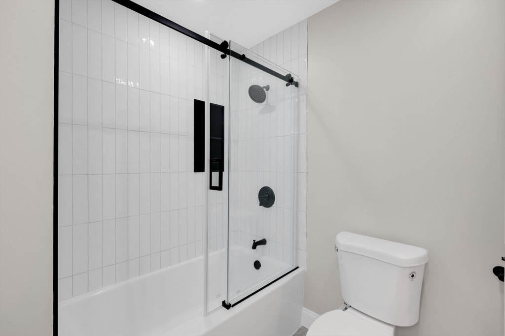 92 Grove Street West Springfield, MA 01089 - Photo 26 of 41 a bathroom with a shower and a toilet