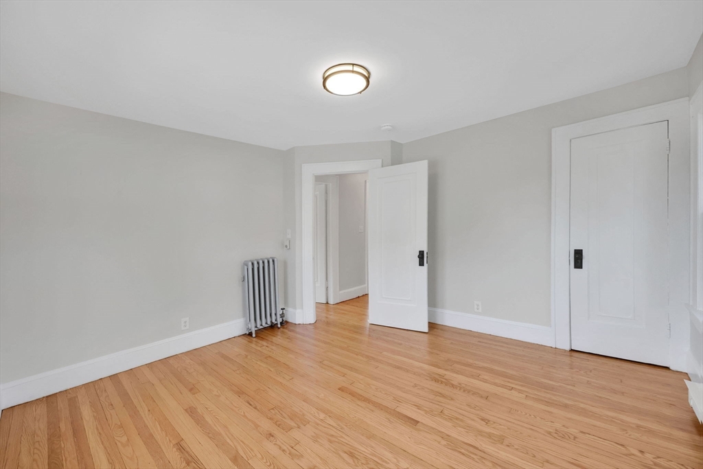 92 Grove Street West Springfield, MA 01089 - Photo 35 of 41 a view of empty room with wooden floor