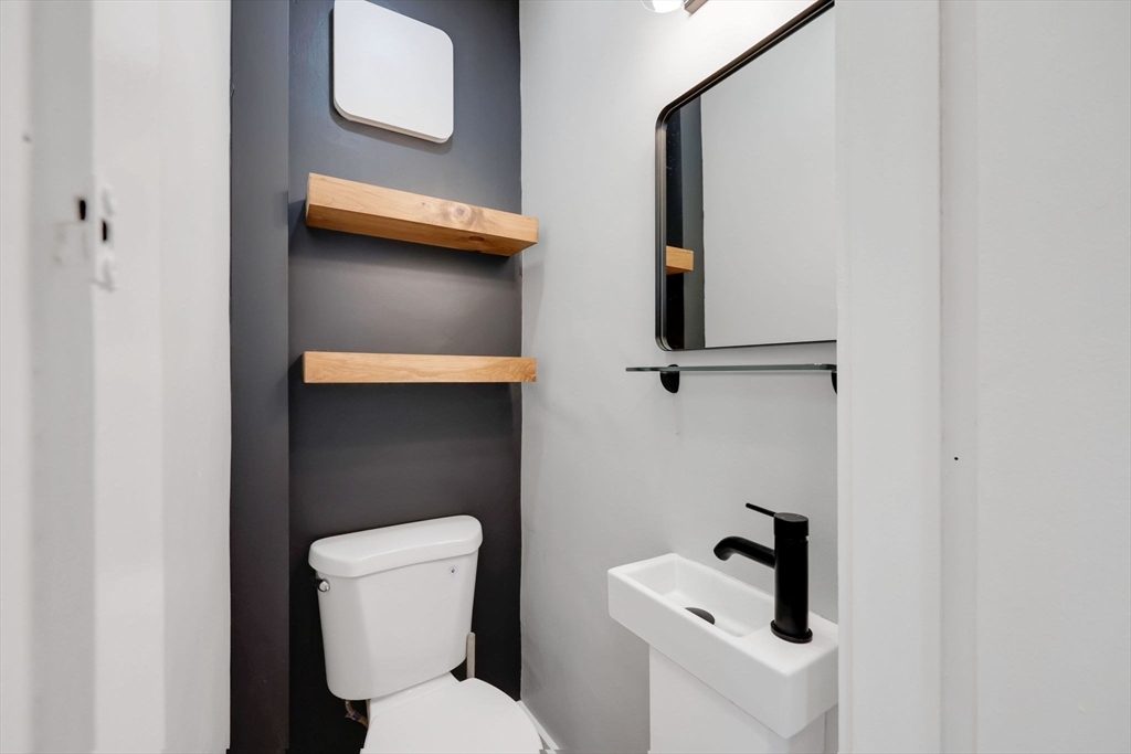 92 Grove Street West Springfield, MA 01089 - Photo 6 of 41 a bathroom with a toilet and sink