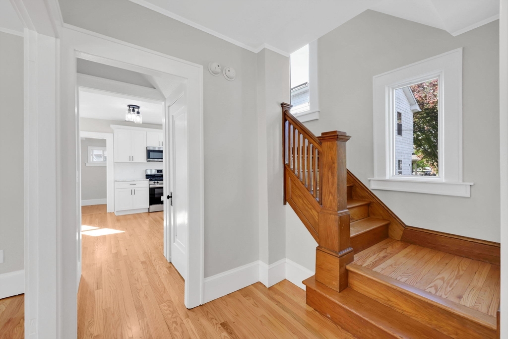 92 Grove Street West Springfield, MA 01089 - Photo 7 of 41 a view of entryway with wooden floor and stairs