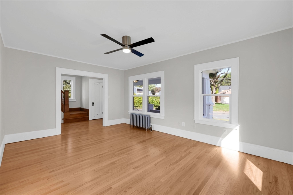 92 Grove Street West Springfield, MA 01089 - Photo 8 of 41 a view of empty room with wooden floor and window