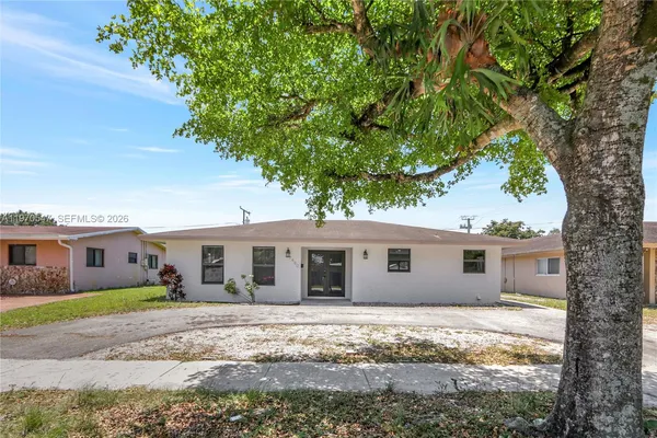 front view of house with a tree