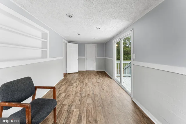 a view of a livingroom with furniture and wooden floor