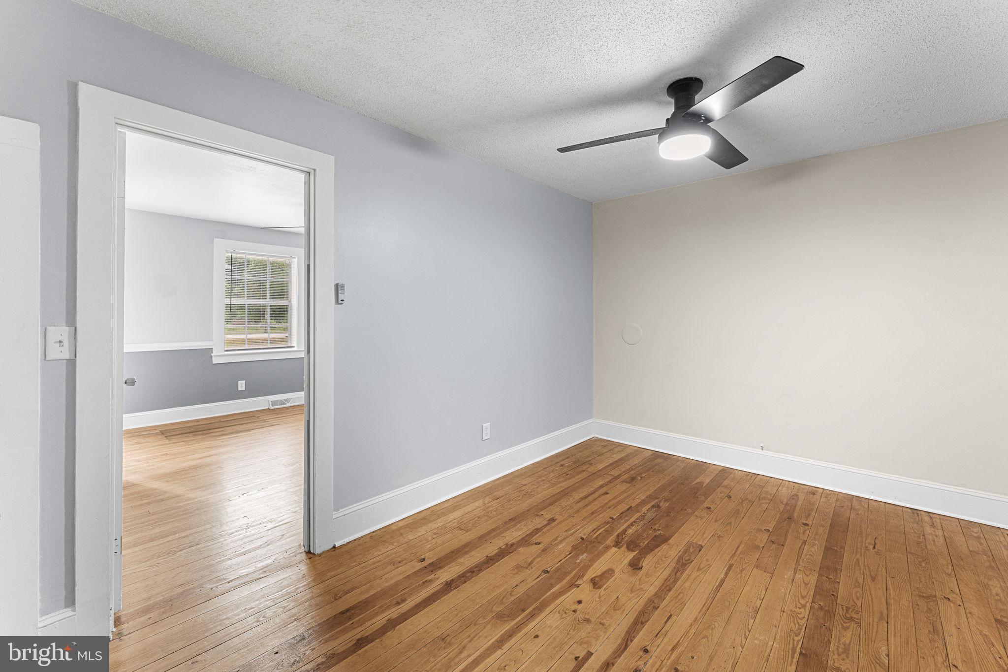 1678 Weems Road Weems, VA 22576 - Photo 19 of 30 wooden floor in an empty room