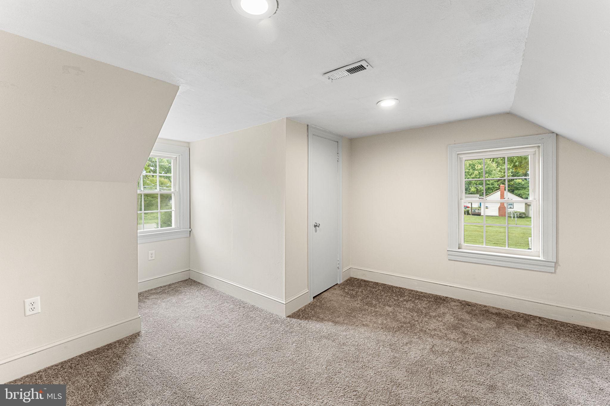 1678 Weems Road Weems, VA 22576 - Photo 22 of 30 an empty room with windows
