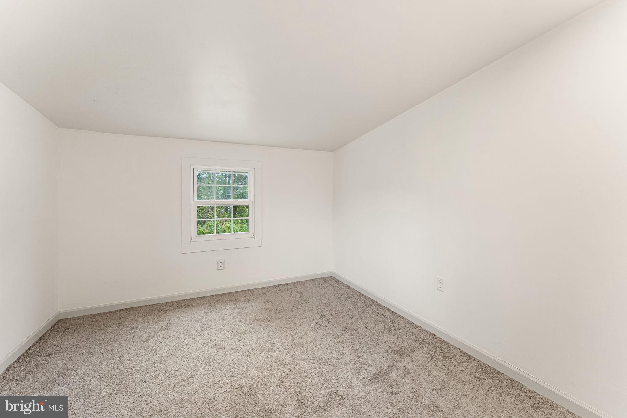 1678 Weems Road Weems, VA 22576 - Photo 24 of 30 an empty room with a window
