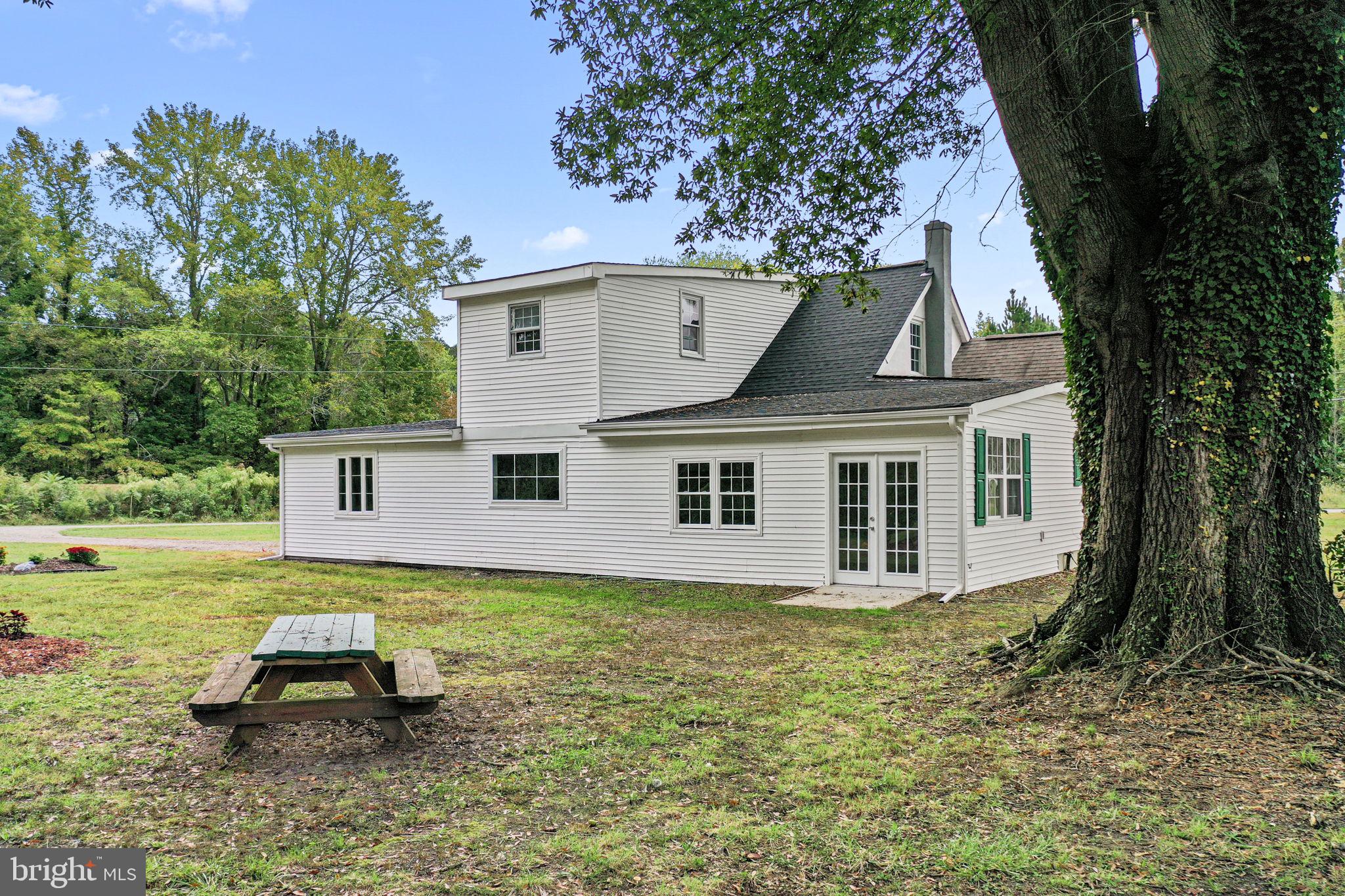 1678 Weems Road Weems, VA 22576 - Photo 28 of 30 a front view of a house with a yard