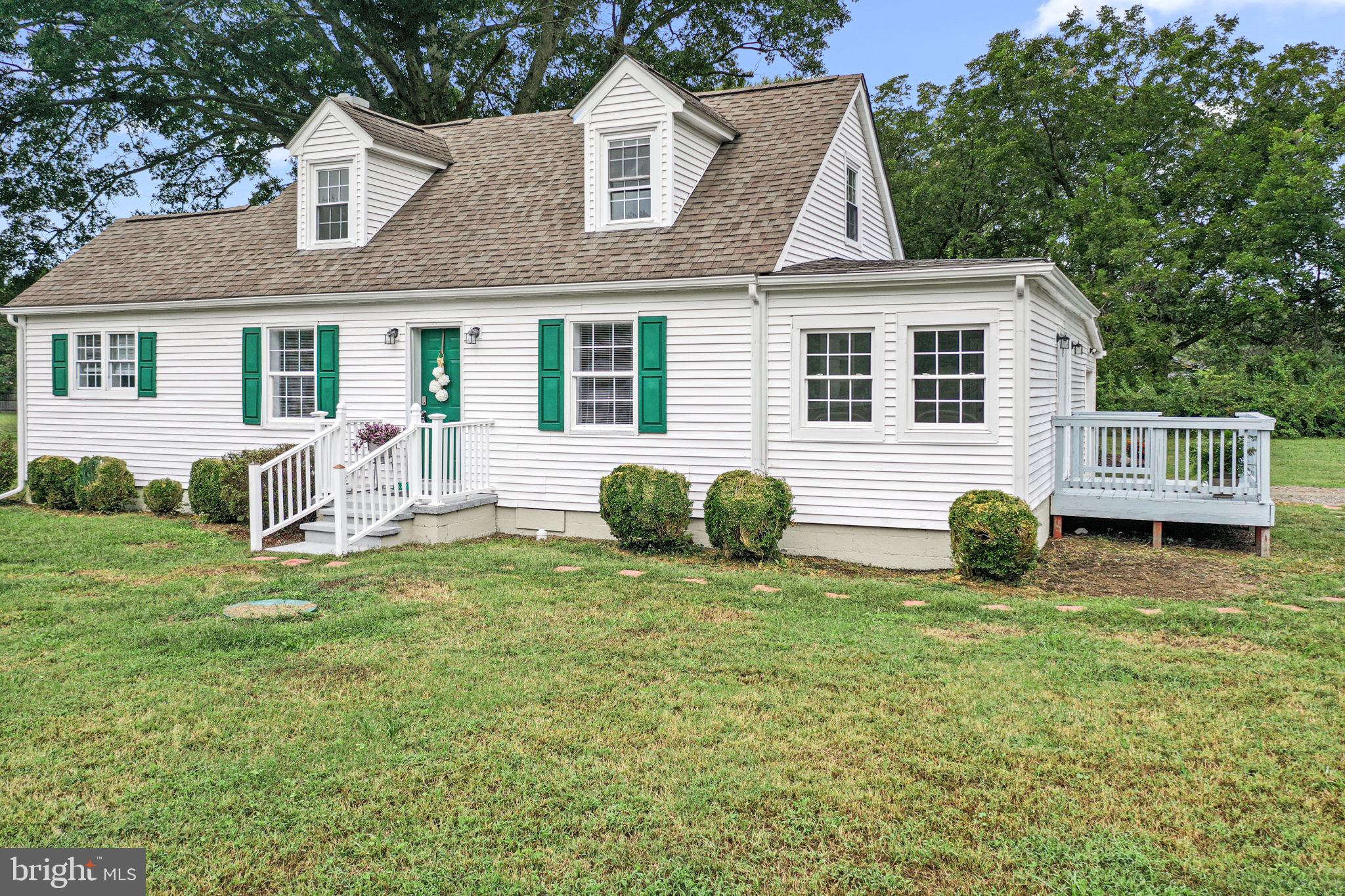 1678 Weems Road Weems, VA 22576 - Photo 4 of 30 a view of a house with a yard and chairs