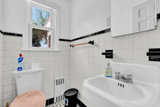 a bathroom with a sink a toilet and a bathtub