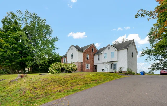 a front view of a house with a yard