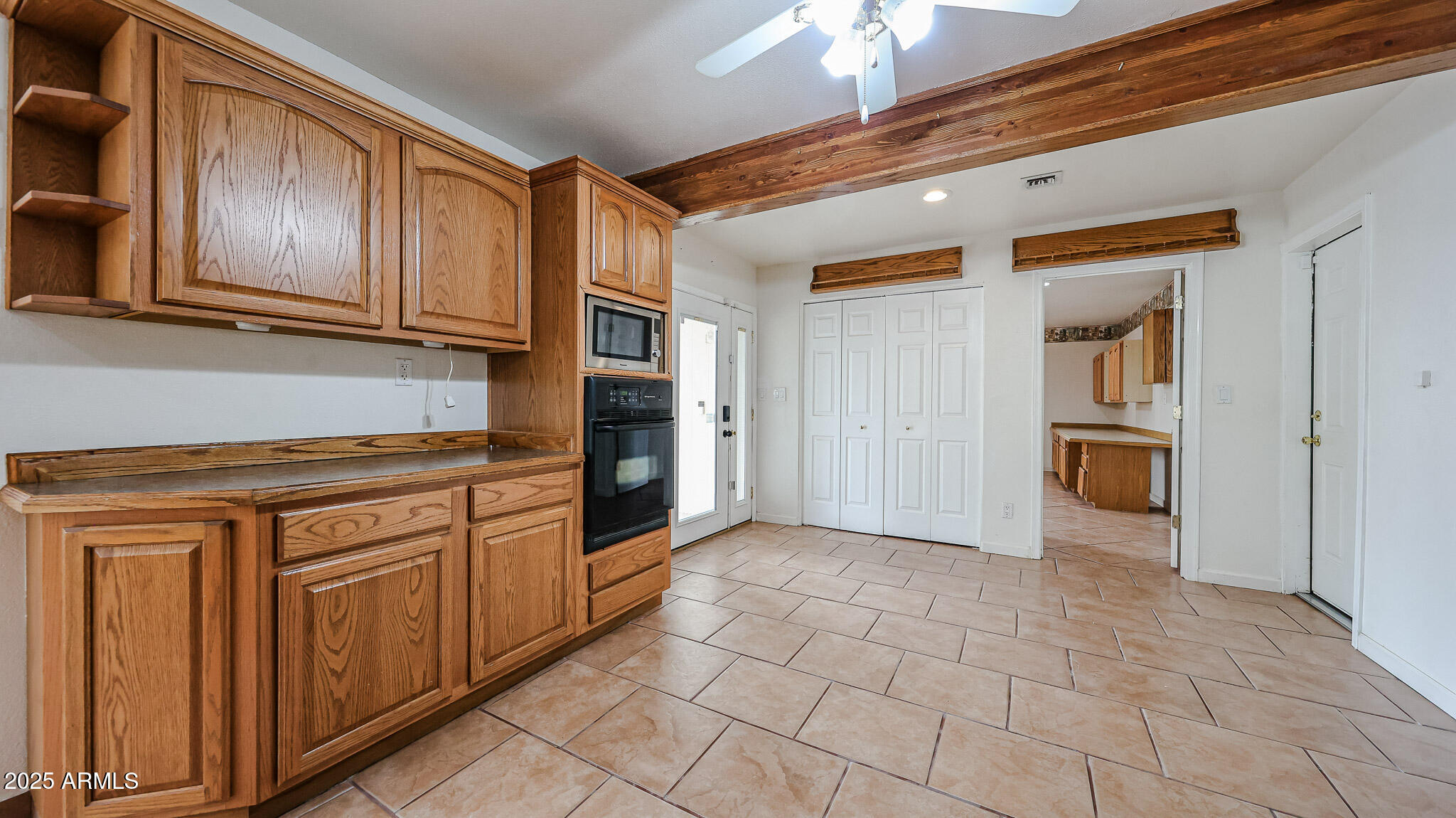 11851 North Thunderbird Road Sun City, AZ 85351 - Photo 14 of 46 a kitchen with stainless steel appliances granite countertop a refrigerator and a stove