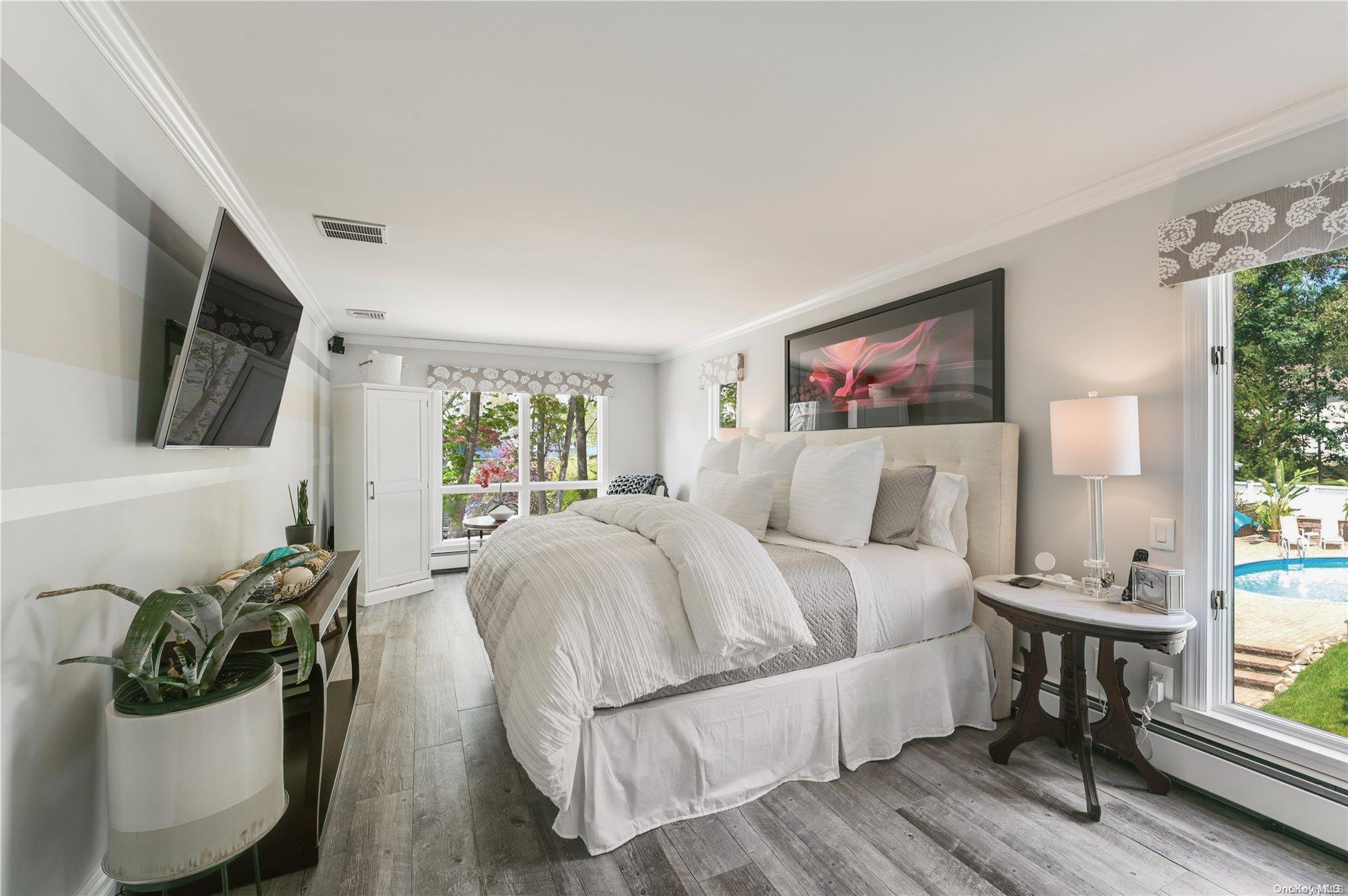 355 Windjammer Drive Southold, NY 11971 - Photo 12 of 21 a bed room with a bed and a television