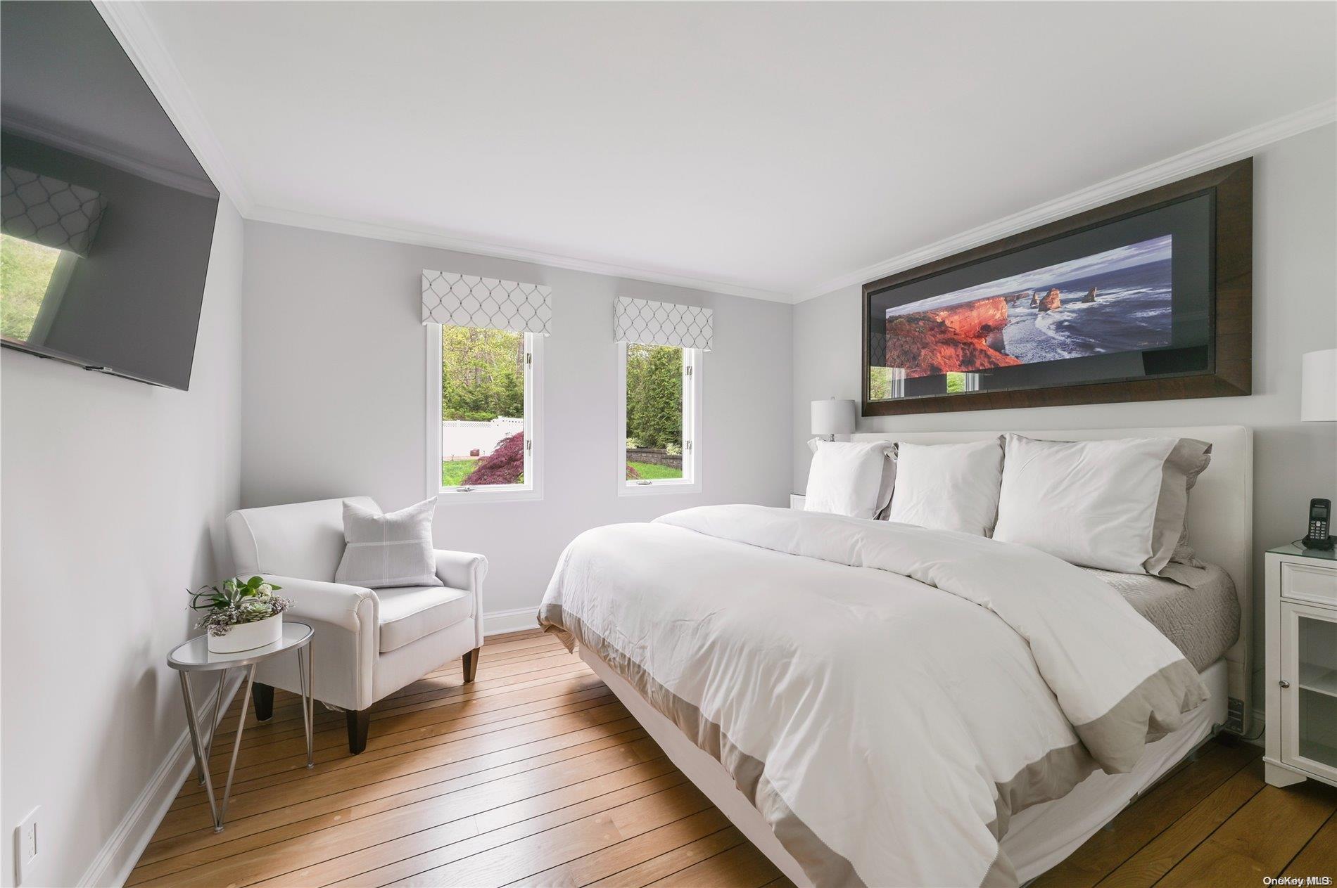 355 Windjammer Drive Southold, NY 11971 - Photo 17 of 21 a bedroom with bed and window