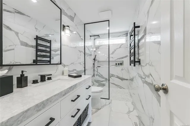 a bathroom with a double vanity sink mirror double and shower
