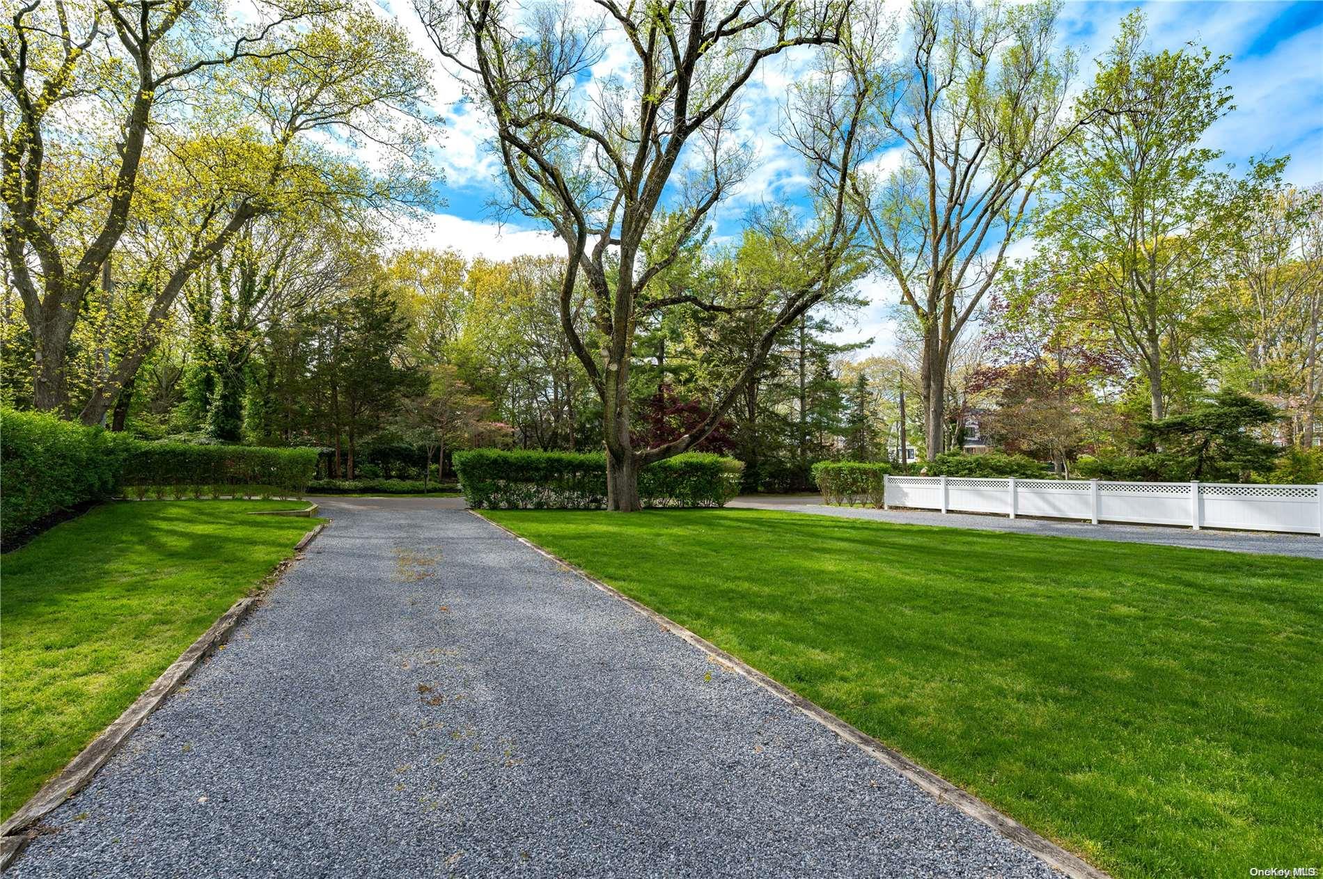 355 Windjammer Drive Southold, NY 11971 - Photo 20 of 21 a view of a park with large trees