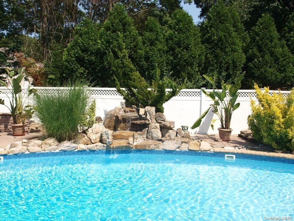 355 Windjammer Drive Southold, NY 11971 - Photo 3 of 21 a view of a garden with lawn chairs