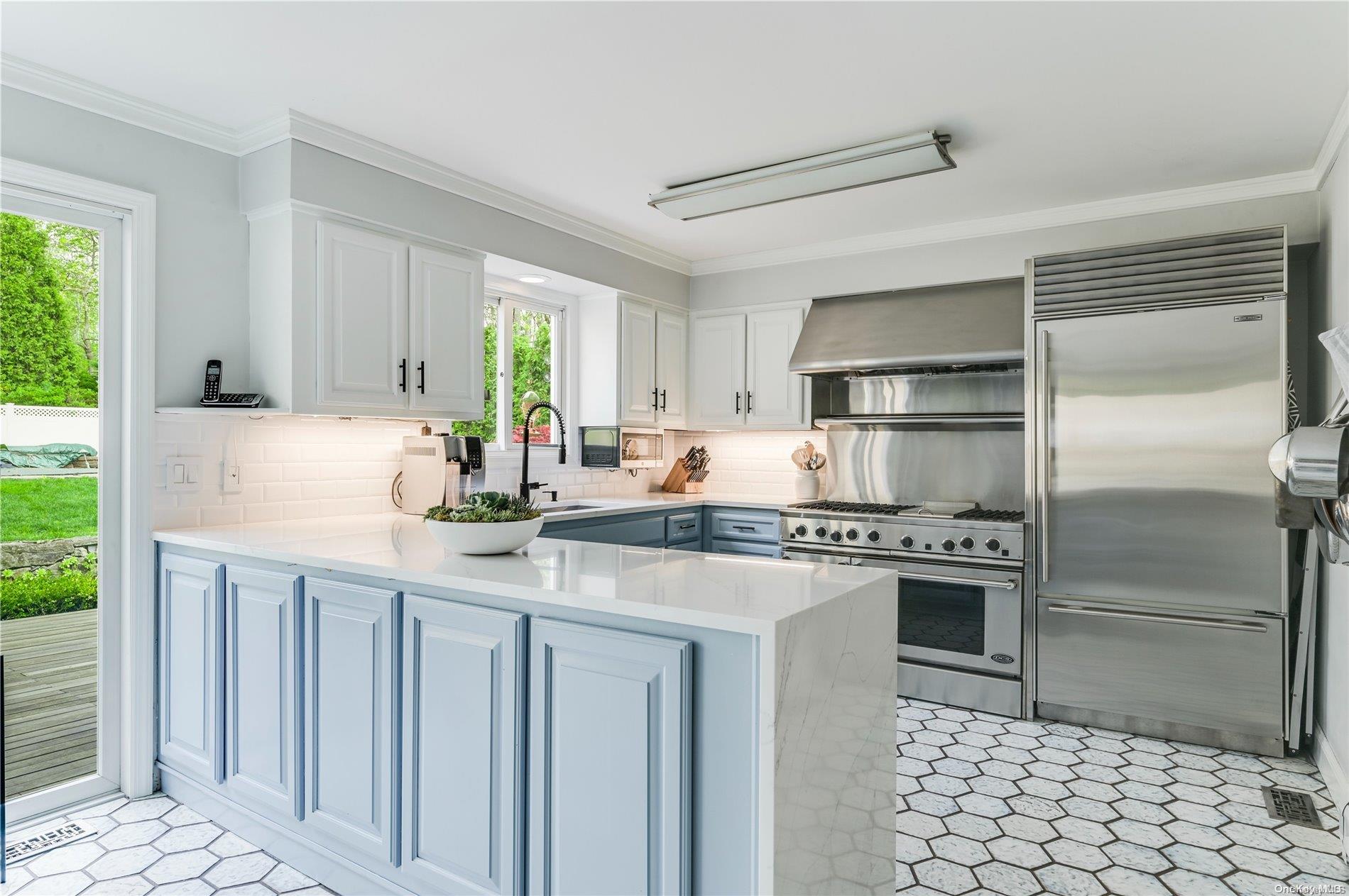 355 Windjammer Drive Southold, NY 11971 - Photo 5 of 21 a kitchen with stainless steel appliances granite countertop a sink stove and refrigerator