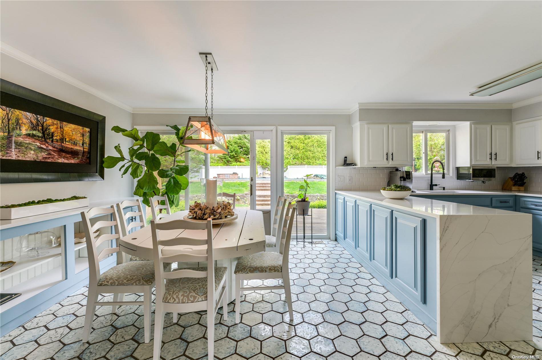 355 Windjammer Drive Southold, NY 11971 - Photo 7 of 21 a living room with furniture a flat screen tv and a dining table