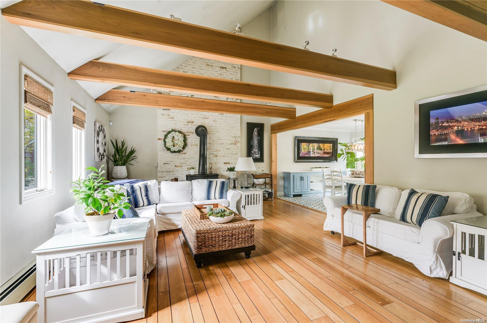 355 Windjammer Drive Southold, NY 11971 - Photo 9 of 21 a living room with furniture and a large window