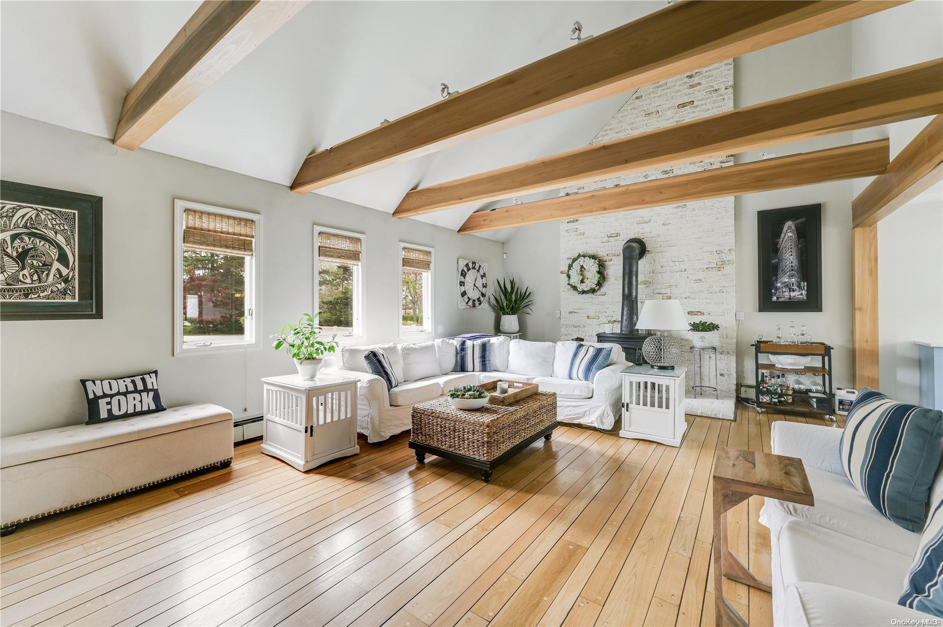 355 Windjammer Drive Southold, NY 11971 - Photo 10 of 21 a living room with furniture and a large window