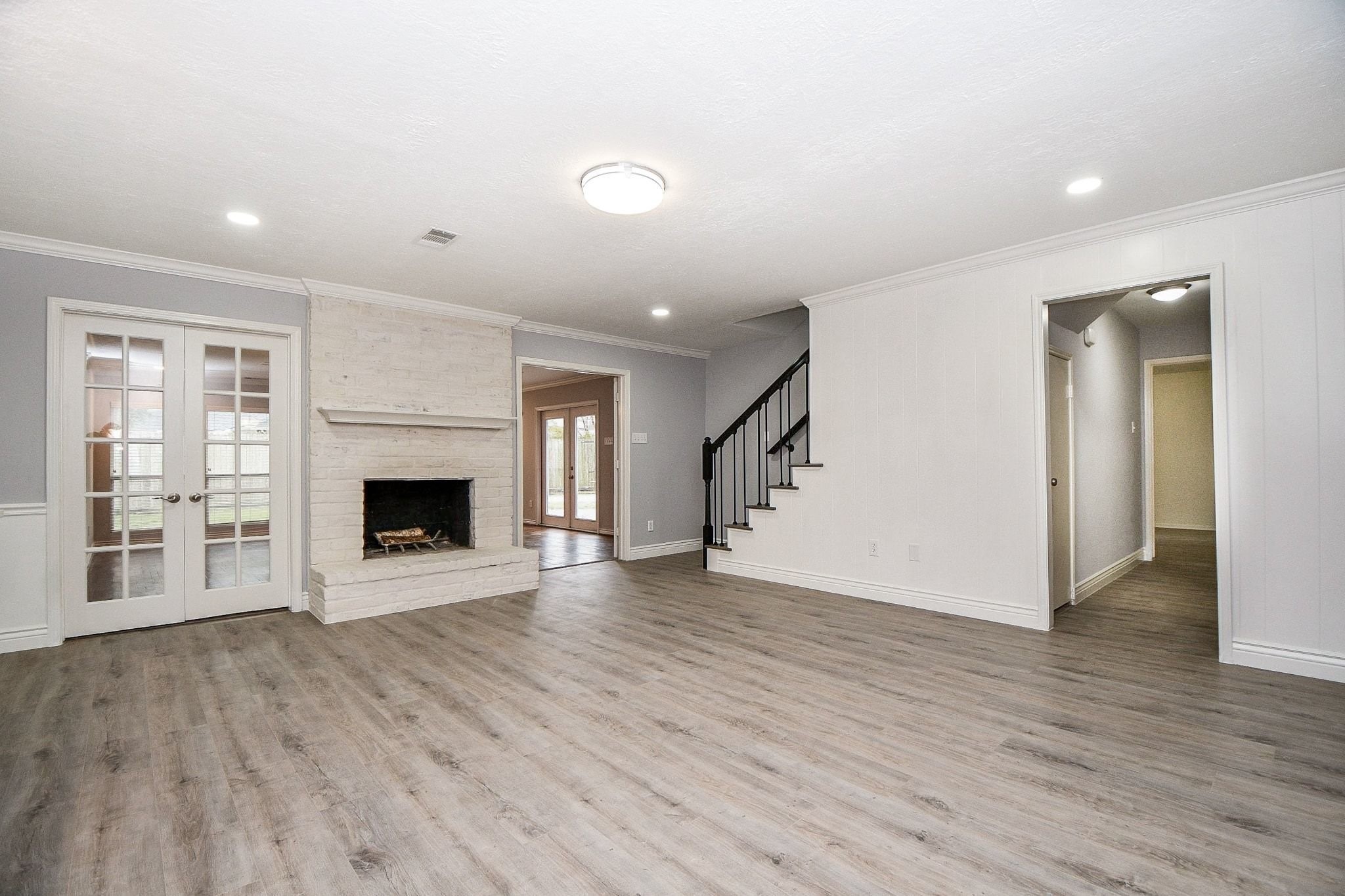 14011 Wickersham Lane Houston, TX 77077 - Photo 13 of 38 Centrally located, open-concept family room with fireplace.