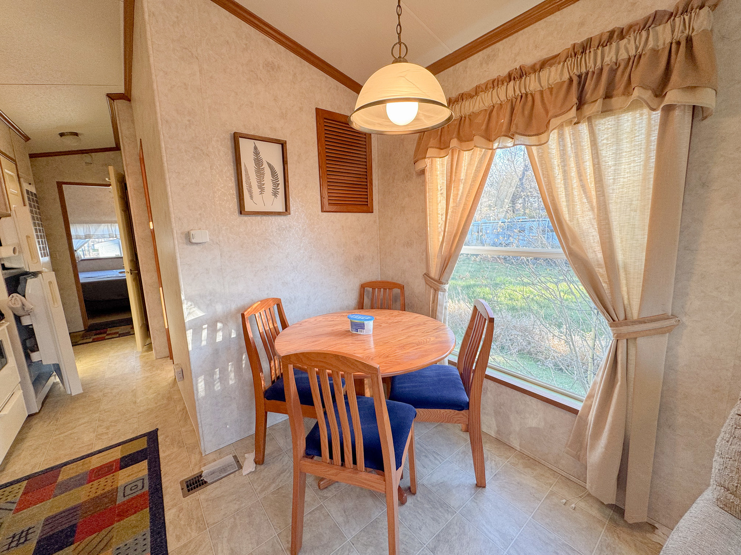 29-7 Woodhaven Sublette, IL 61367 - Photo 12 of 22 a view of a dining room with furniture window and wooden floor