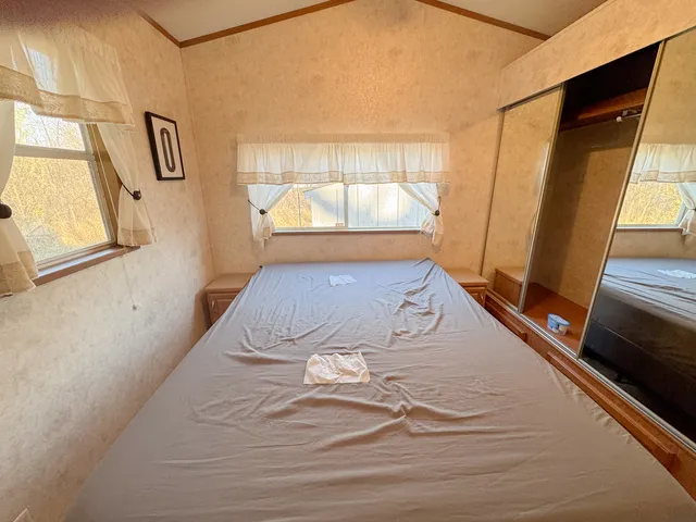 a view of front door with wooden floor
