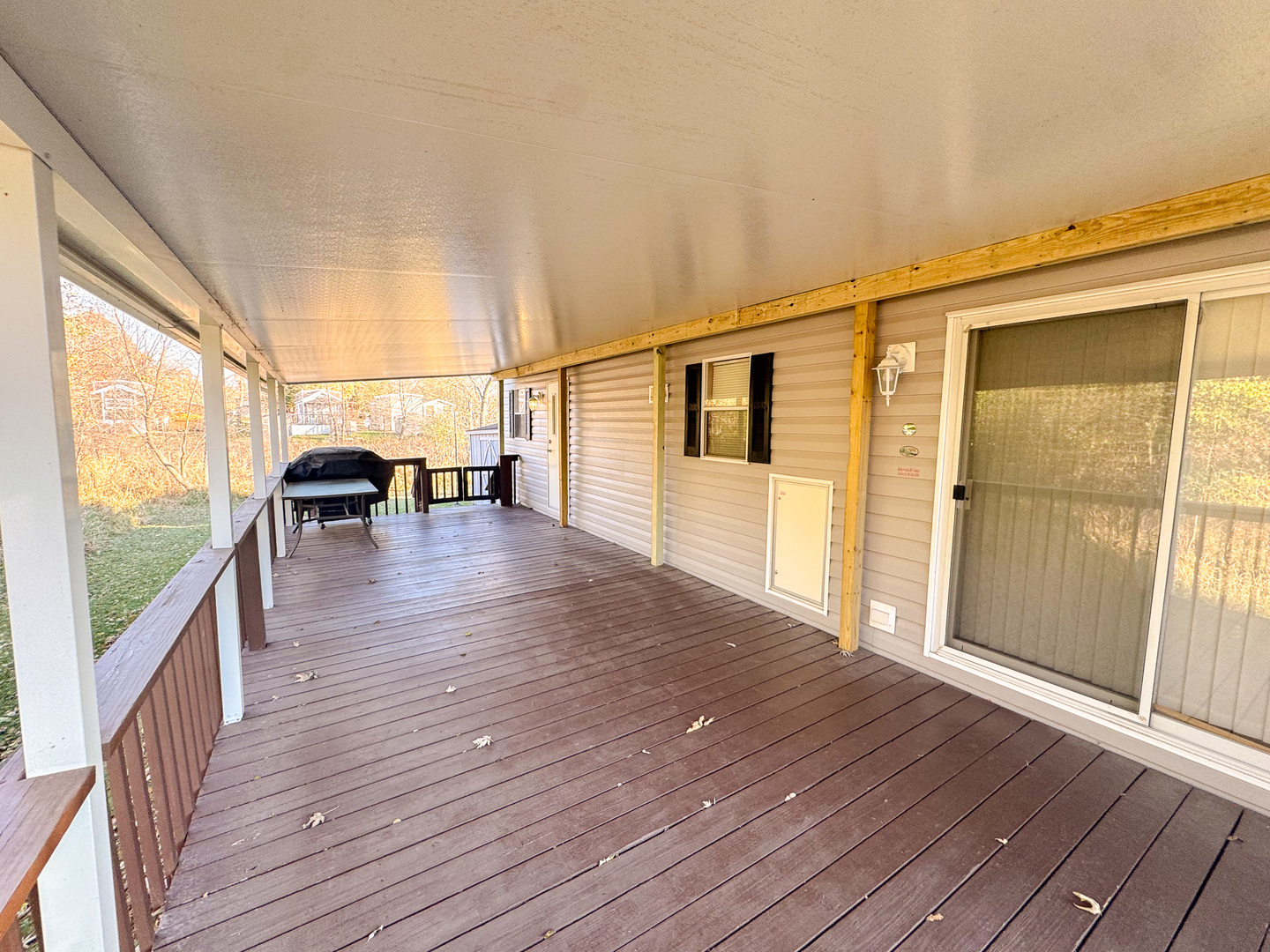 29-7 Woodhaven Sublette, IL 61367 - Photo 5 of 22 a view of a balcony with wooden floor