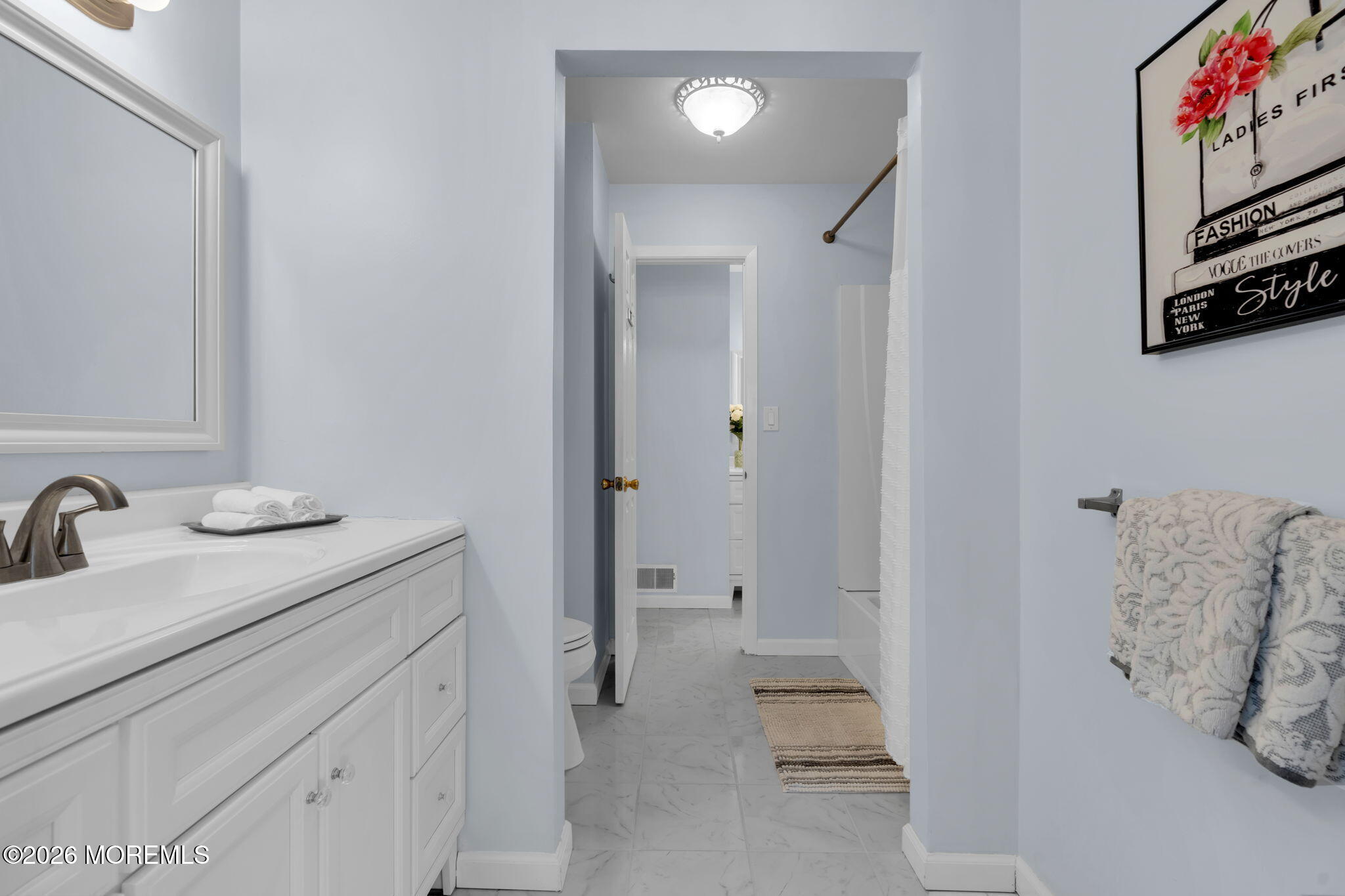 375 Middlewood Road Middletown, NJ 07748 - Photo 17 of 36 a bathroom with a sink and a mirror