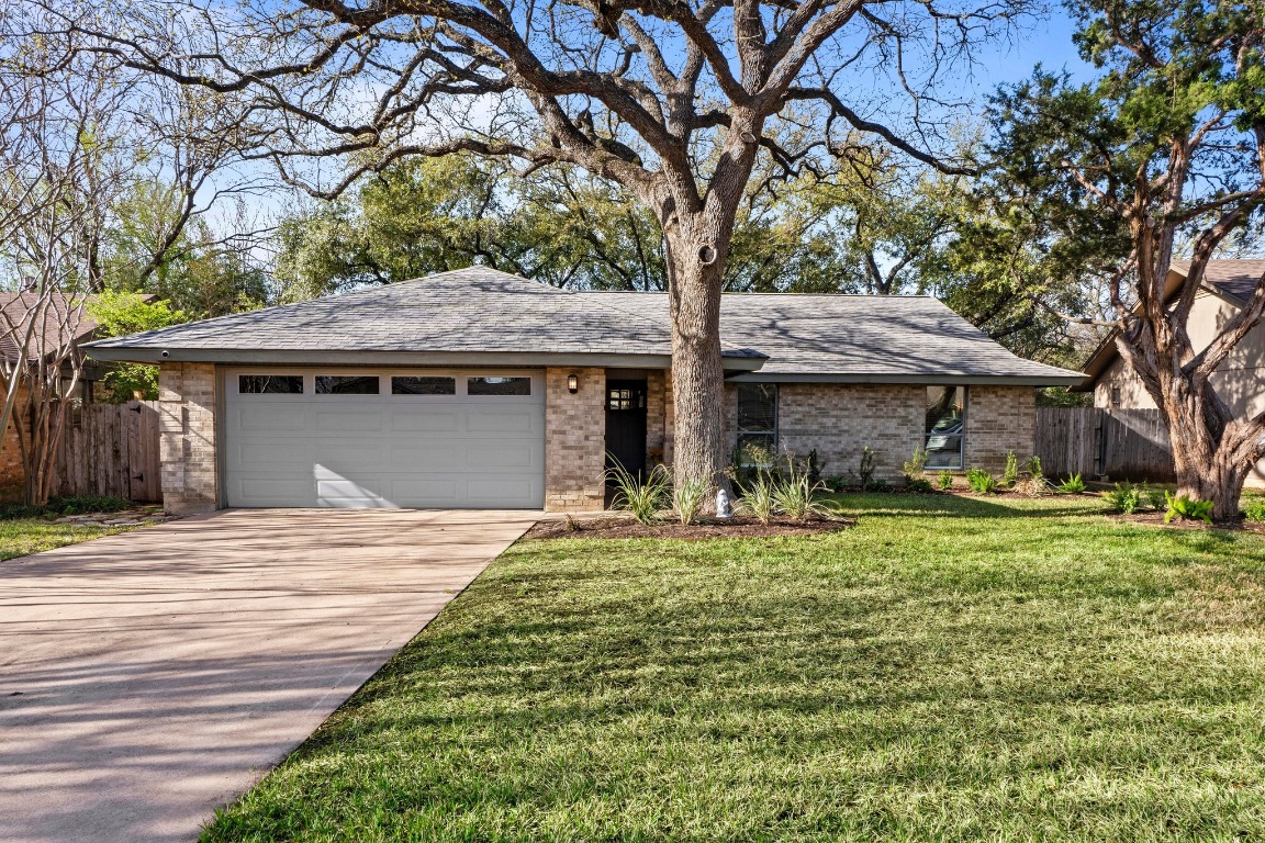 4811 Canyonbend Circle Austin, TX 78735 - Photo 1 of 22 a front view of a house with a garden