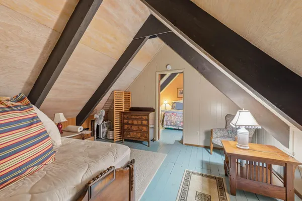 a view of an entryway with wooden floor and windows