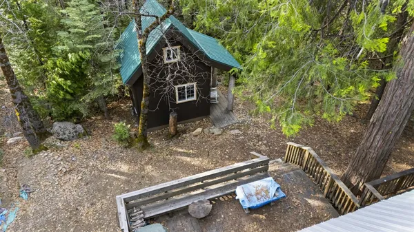 a backyard of a house with outdoor seating