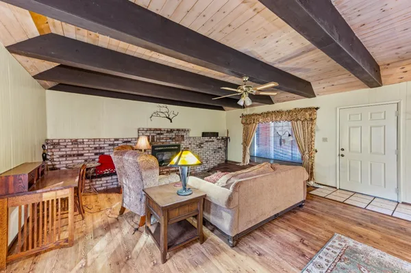 a view of a chairs and table in the balcony
