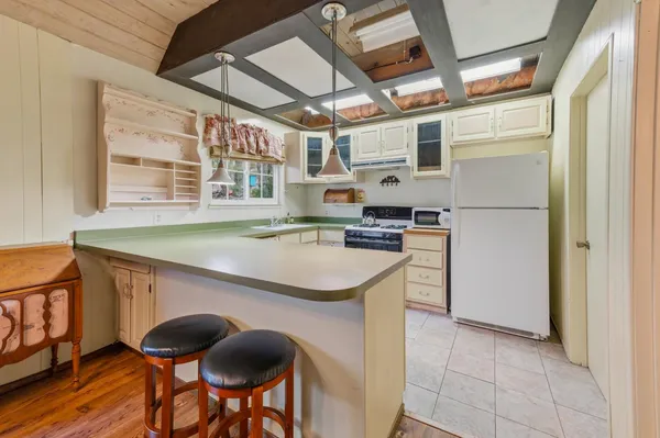 a kitchen that has a cabinets and a stove