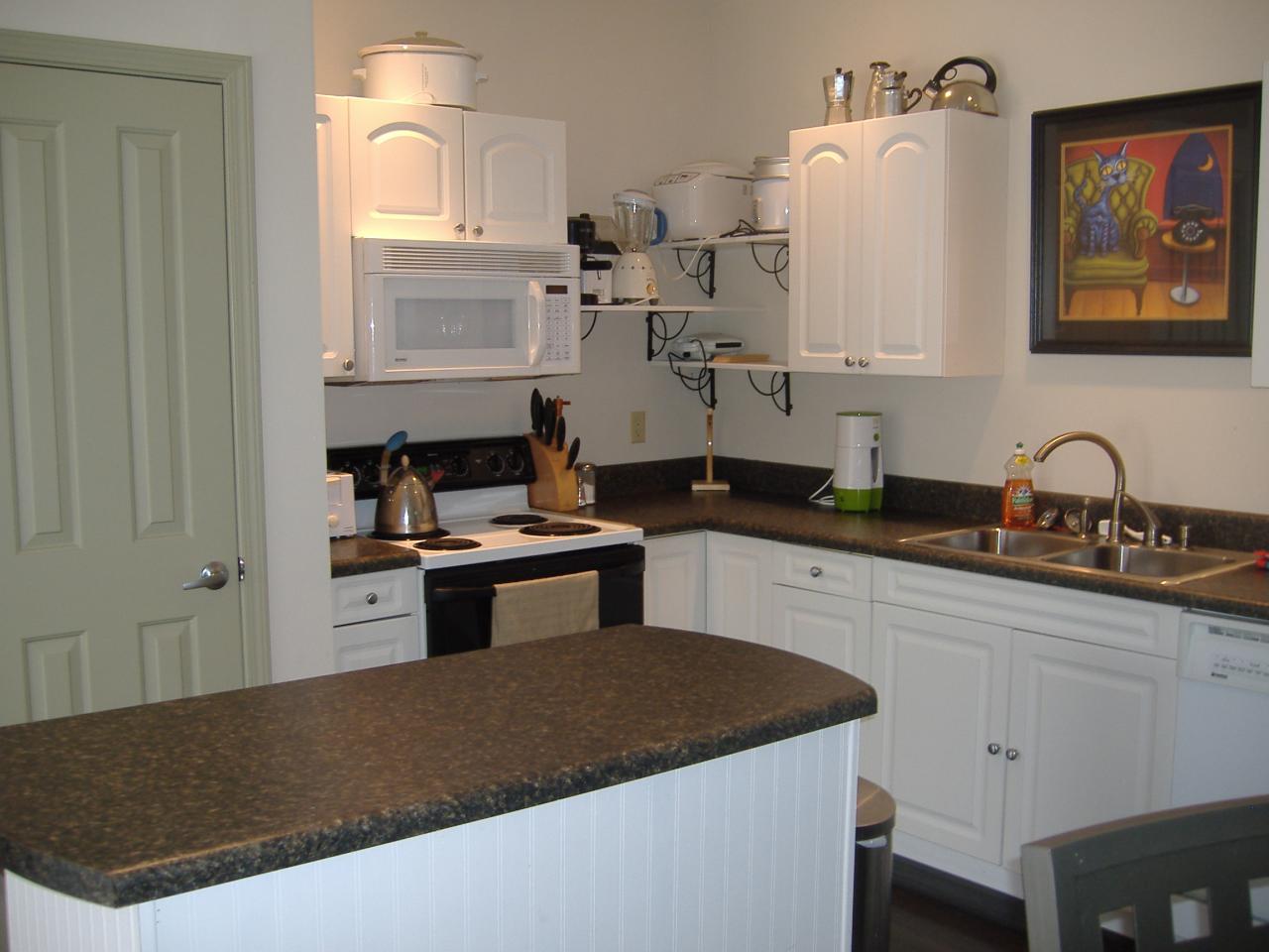 740 Dusty Rock Road Northwest Riner, VA 24149 - Photo 10 of 16 a kitchen with granite countertop a sink stainless steel appliances and cabinets
