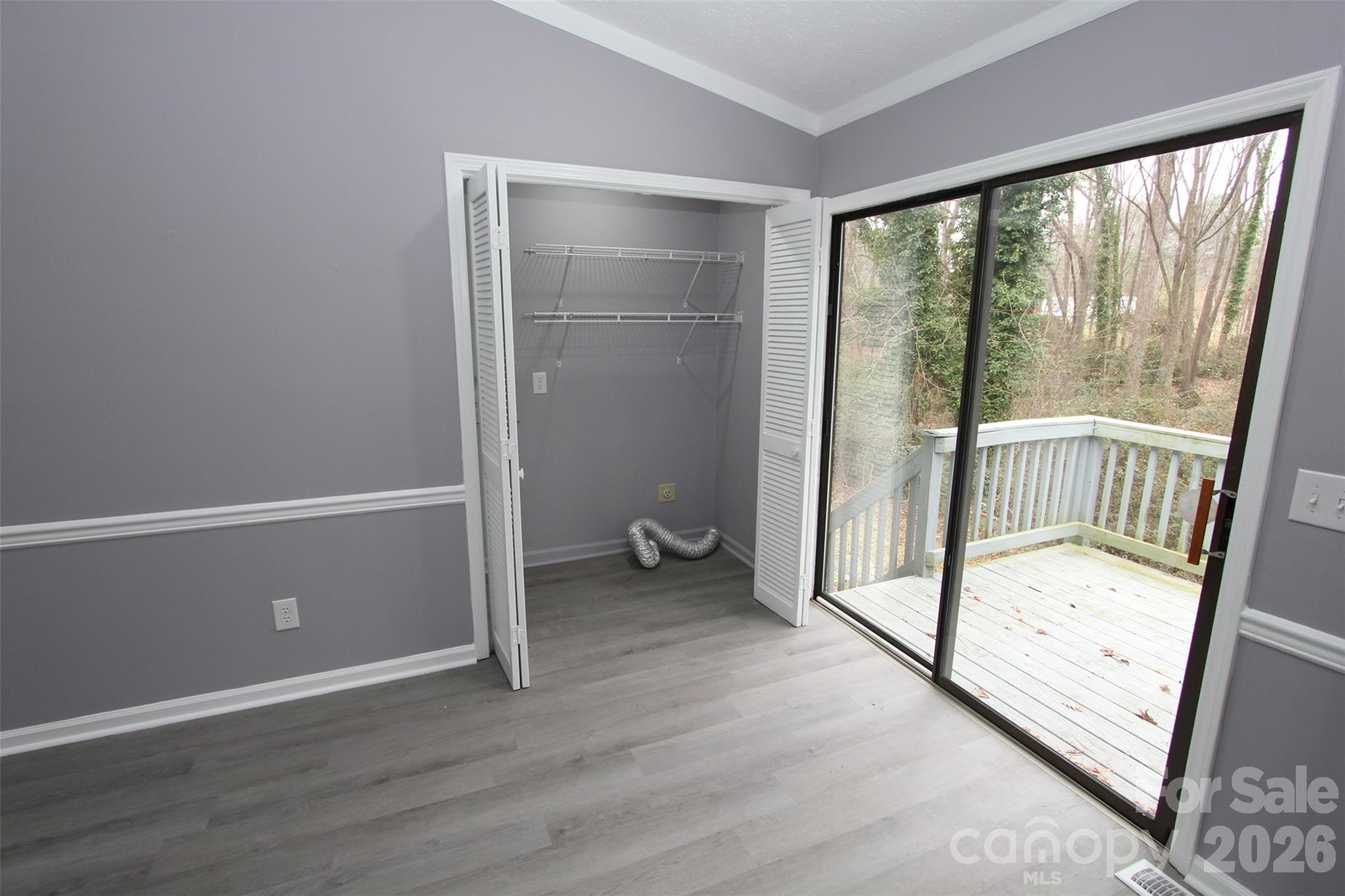 48 Piper Road Wadesboro, NC 28170 - Photo 14 of 34 an empty room with wooden floor and windows