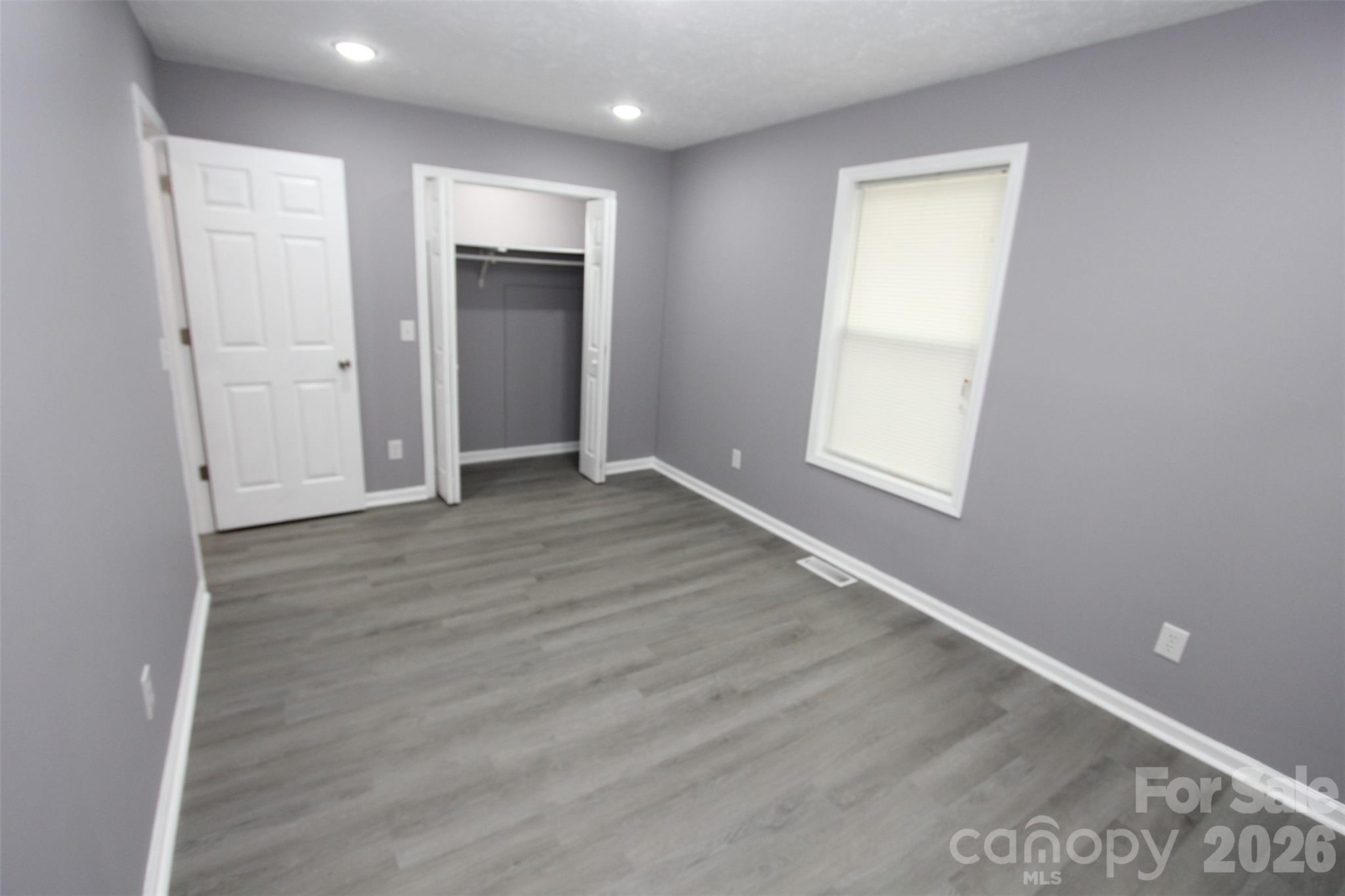 48 Piper Road Wadesboro, NC 28170 - Photo 18 of 34 an empty room with wooden floor and closet area